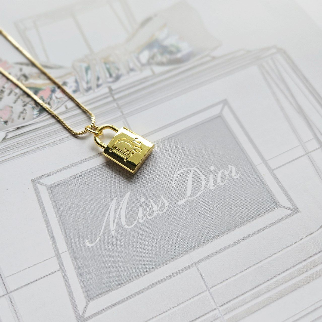 Christian dior store padlock necklace