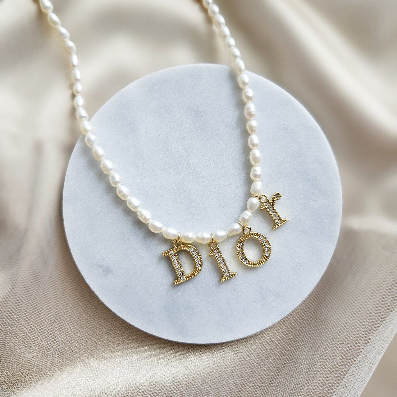 Dior spell out necklace best sale